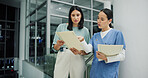 Team, documents and nurse or women in hospital for ward clerk, icu emergency and medical records at night. Healthcare administration, surgery schedule and discussion with people for overtime