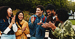 College, students or friends with applause on campus for congratulations, scholarship goal or success. Achievement, support or group of people with outdoor clap for celebration, good news or excited