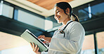 Medical, low angle or woman in hospital with tablet, telehealth or positive results in patient treatment. Healthcare, smile or doctor in clinic with tech, online service or good news in diagnosis.