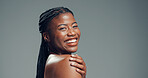 Portrait, skincare and black woman in studio, smile and dermatology on grey background. Space, shine and African person with wellness, happiness and beauty with cosmetics, healthy skin and aesthetic