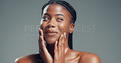 Buy stock photo Beauty, thinking and black woman in studio for skincare, facial glow and soft texture for wellness. Mischievous expression, shine and person with smooth skin, self care and space on gray background