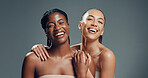 Skincare, portrait and happy with women in studio for beauty, glow and self care diversity. Shine, dermatology and aesthetic with people on gray background space for clear skin, hydration and support