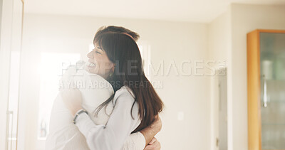 Buy stock photo Happy couple, hug and love with embrace in home for relationship, commitment or trust together. Man, woman or care with smile, comfort or romance for valentines day, bonding or weekend break in house
