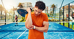 Tennis elbow, joint pain or man on court with sports injury, outdoor workout or sprain for inflammation. Padel racket, muscle tension or athlete with strain from training game tendinitis or accident