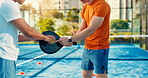 Hands, coach and padel with discussion, sports and position for coordination, power and strategy at club. People, mentor and athlete with racket, guide or fitness at tennis court for practice routine
