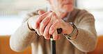 Senior man, hands and cane in home for balance, retirement and support for arthritis recovery. Walking stick, mobility aid and person with disability from injury, assistance and osteoporosis care