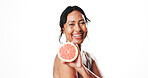 Portrait, skincare and mature woman with grapefruit, mockup space or facial treatment with vitamin c. White background, natural cosmetics and anti aging benefits for person, happy and dermatology