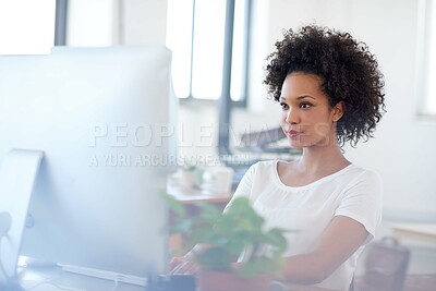 Buy stock photo Confident woman working at her desk in an open office space