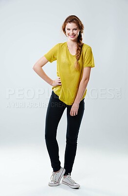 Buy stock photo Woman, smile and casual fashion in studio with tshirt, trendy outfit and natural beauty with positive attitude. Girl, portrait and stylish clothes with aesthetic, pride and model on white background