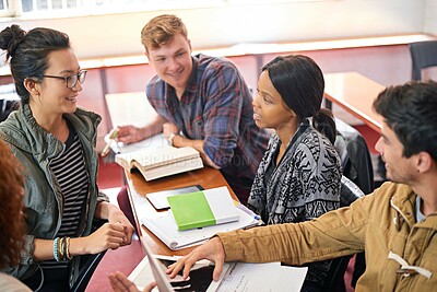 Buy stock photo Students, group and studying in discussion with books, tablet and diversity in library for education. Men, women and friends at university, tech and talking for solution, planning and ready for exam