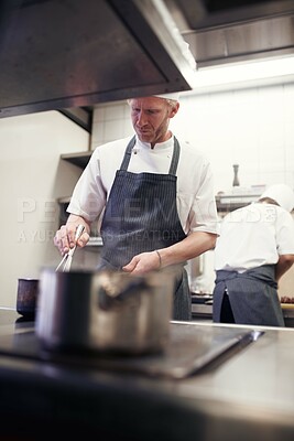 Buy stock photo Professional, chef and man with pot on stove, restaurant and cooking staff and gourmet meal prep. Serious, catering and culinary skills for food service, nutrition and working in hospitality industry