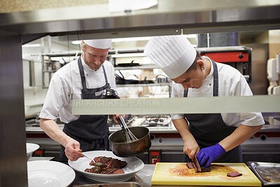Buy stock photo Chefs, sausage and men cutting in kitchen of restaurant for dinner, lunch or supper with hospitality. Career, catering and culinary staff with knife chop steak meat for fine dining in gourmet cafe.