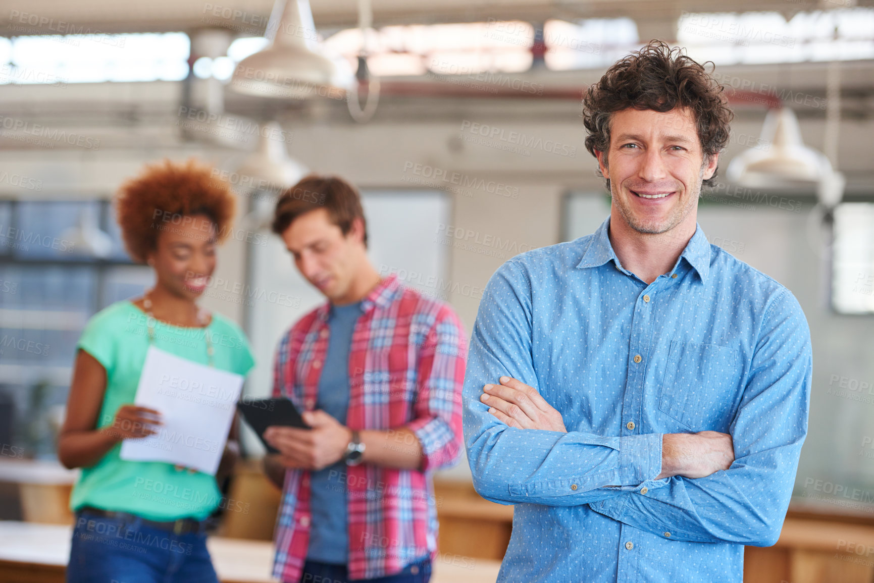 Buy stock photo Portrait, arms crossed and businessman with staff in creative agency, professional and confident. Brand promotion, pride and graphic designer with meeting for project management, smile and about us