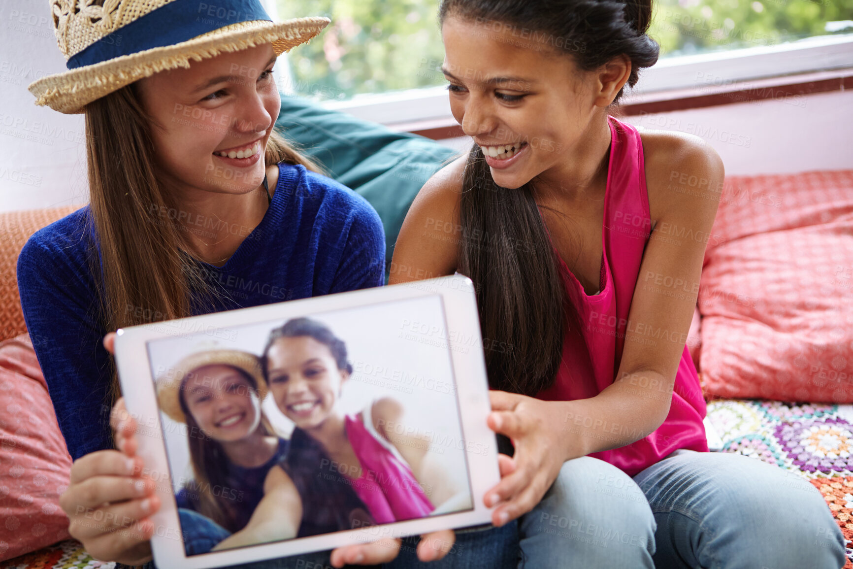 Buy stock photo Happy children, tablet screen and profile picture with friends in home, social media post and selfie. Tech, girls and photo in house with teenager to show memory, capture moment or bonding together