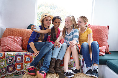 Buy stock photo Teenager, friends and laugh with selfie in home for holiday memory, online post and hangout together. Weekend, happy girls and photography on sofa for social media upload, profile picture and bonding