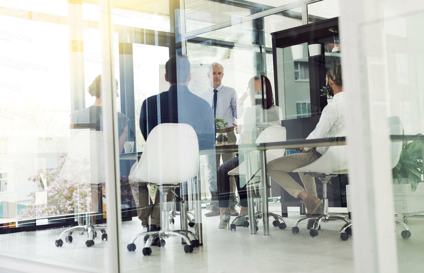 Buy stock photo Shot of corporate businesspeople in the office