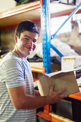Buy stock photo Man, portrait and boxes in garage for moving with investment in real estate, new house and home. Property, delivery and person with smile or cardboard for storage, cargo and package order security