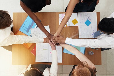 Buy stock photo Shot of a group colleagues reaching their hands forward together