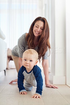 Buy stock photo Mother, child and crawling for development, growth and motor skills in childhood as baby at home. Woman, toddler and play for learning, cognition and support in living room for mobility or balance