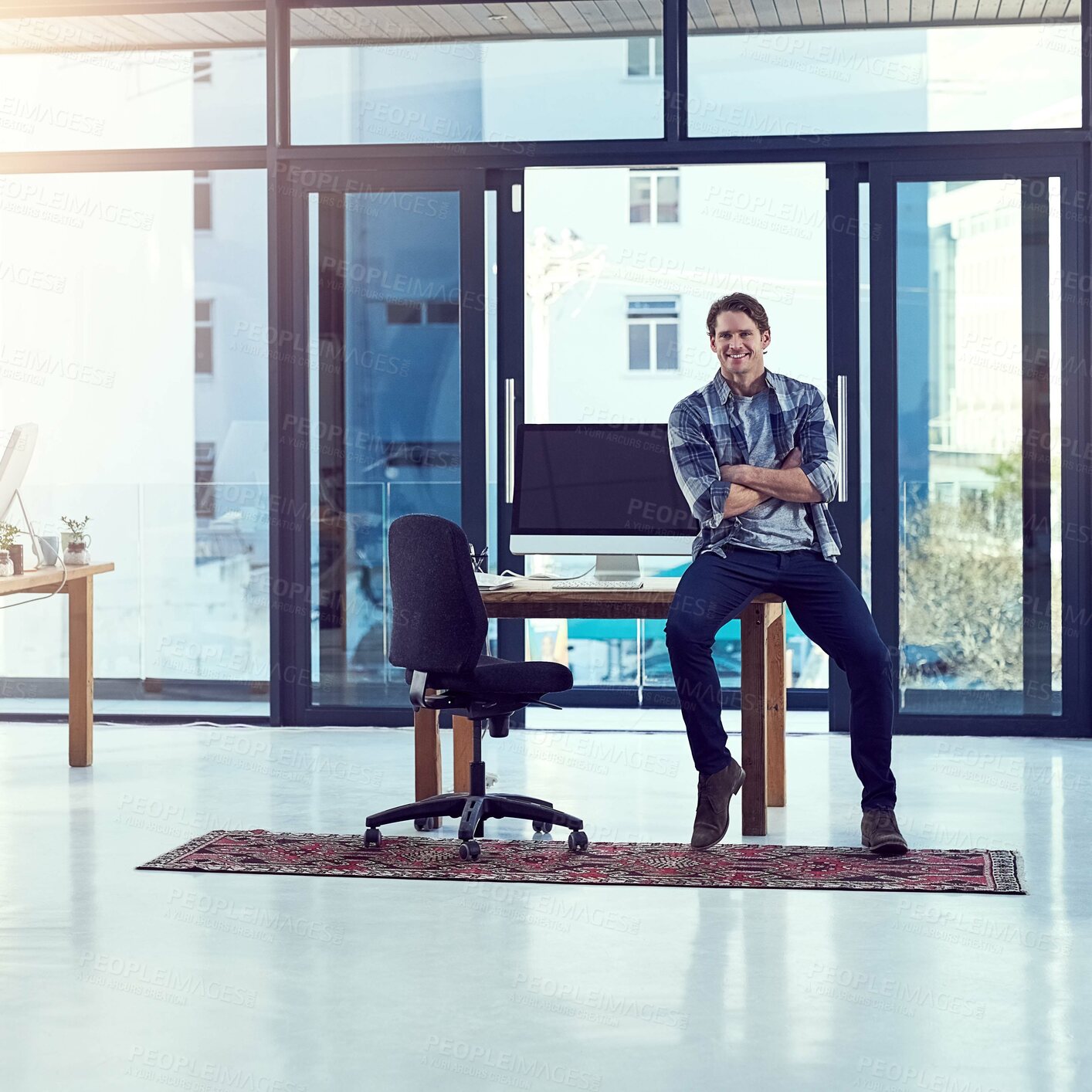 Buy stock photo Man, manager and confidence at desk in office, success and creative career in workplace. Entrepreneur, arms crossed and web design agency for computer screen, business and technology for startup