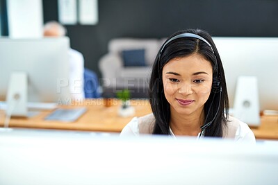 Buy stock photo Callcenter, smile and Asian woman at computer in customer support, help desk or telemarketing office. Headset, online consultation and client service agent in workplace for crm, advice or phone call