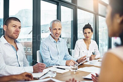 Buy stock photo Creative, business people and team discussion in meeting, planning or brainstorming startup ideas with mature manager. Designer, group or collaboration on strategy, conversation and writing notes