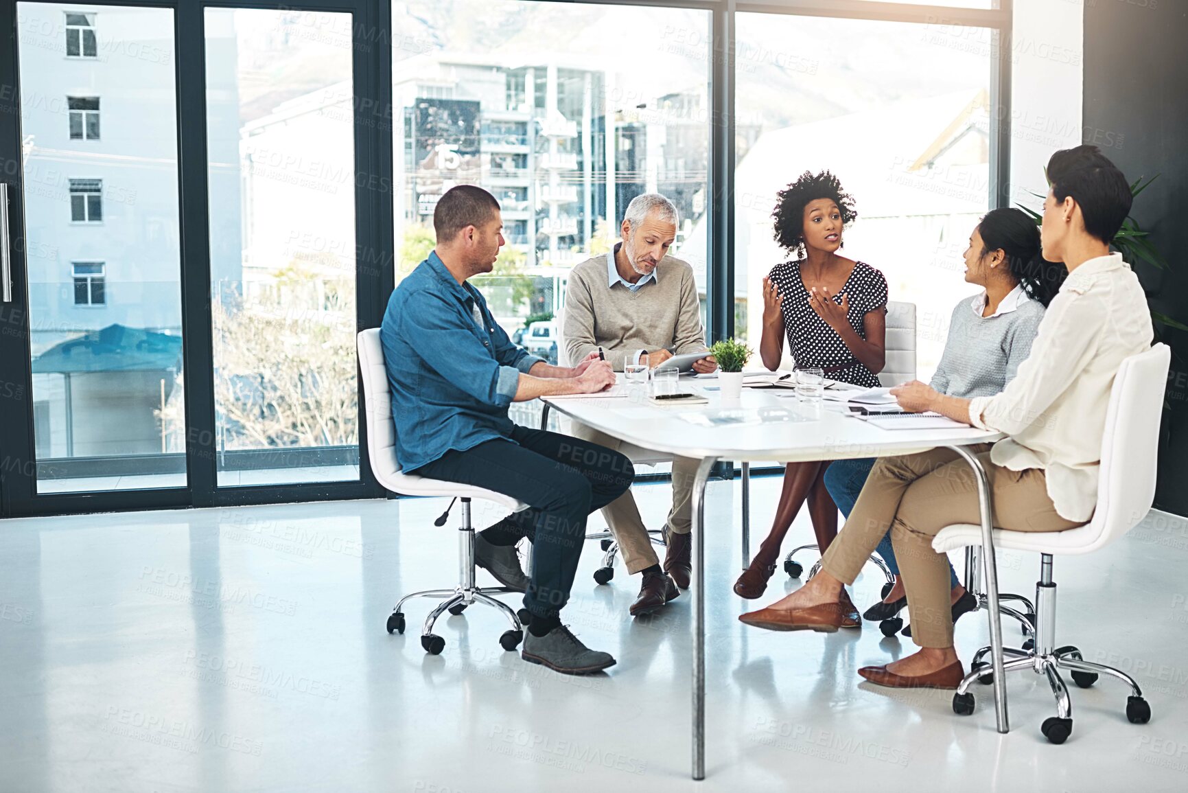 Buy stock photo Creative, business people and group brainstorming in meeting, discussion or plan startup ideas together. Editor, team diversity or collaboration on project strategy, conversation or tablet research