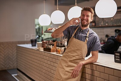 Buy stock photo Man, coffee shop or cafe phone call with smile for contact, deal and beverage order at small business. Happy, barista or waiter mobile in kitchen for conversation, networking and customer service
