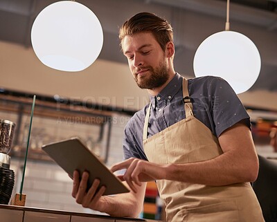 Buy stock photo Tablet, coffee shop or cafe with man for contact, online deal or beverage order at small business. Restaurant, barista or waiter in kitchen with tech for communication, networking or customer service