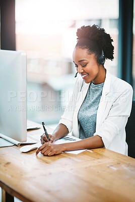 Buy stock photo Woman, writing and planning at call center in customer service, communication and telecom target or goals. African agent, advisor or worker with paperwork, notes or contact information for e commerce