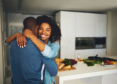 Buy stock photo Black couple, people and happy with hug in kitchen for fun or bonding and love with affection. Home, relationship and smile with support, care and trust with excitement or joy for meal prep with food