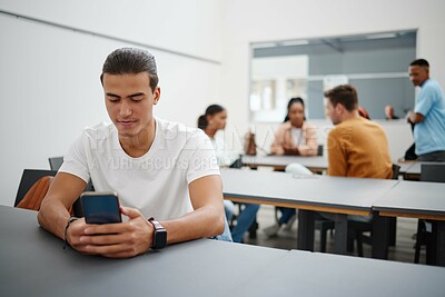 Buy stock photo University man and social media on smartphone in lecture auditorium lesson for internet break. Distracted college student busy with phone text communication on online app in education campus.