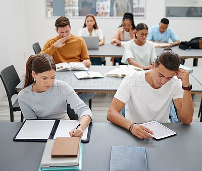 Buy stock photo Diversity, students and university studying in classroom for higher education and training. Student groups learning at college or workshop for development working with books and technology