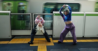 Buy stock photo Asian woman, dancing and railway station by train for energy, art or underground performance in subway. Female person, friends or hip hop dancers in Japan, practice or training together by transport