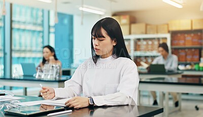 Buy stock photo Science, student and notes in university for research, studying and planning in Japanese lab facility. Asian woman, papers and tech in medical academy for assessment, education or assignment mind map
