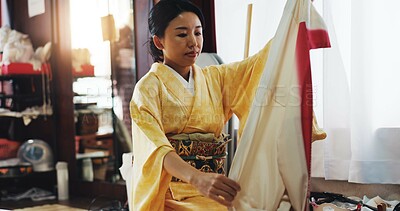 Buy stock photo Fashion designer, clothing and Asian woman with fabric for kimono, traditional and indigenous style. Creative business, boutique and person with textile and material for tailor service in Japan