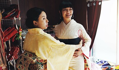 Buy stock photo Asian woman, tailor and size with garment for kimono, style or dress making at boutique. Japan, female person or fashion designer with customer, fabric or waist belt for clothing design at store