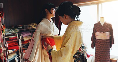 Buy stock photo Asian woman, dress and fashion designer or stylist for kimono, garment or style at boutique. Japan, female people or tailor with customer, waist belt or clothing design for culture or tradition