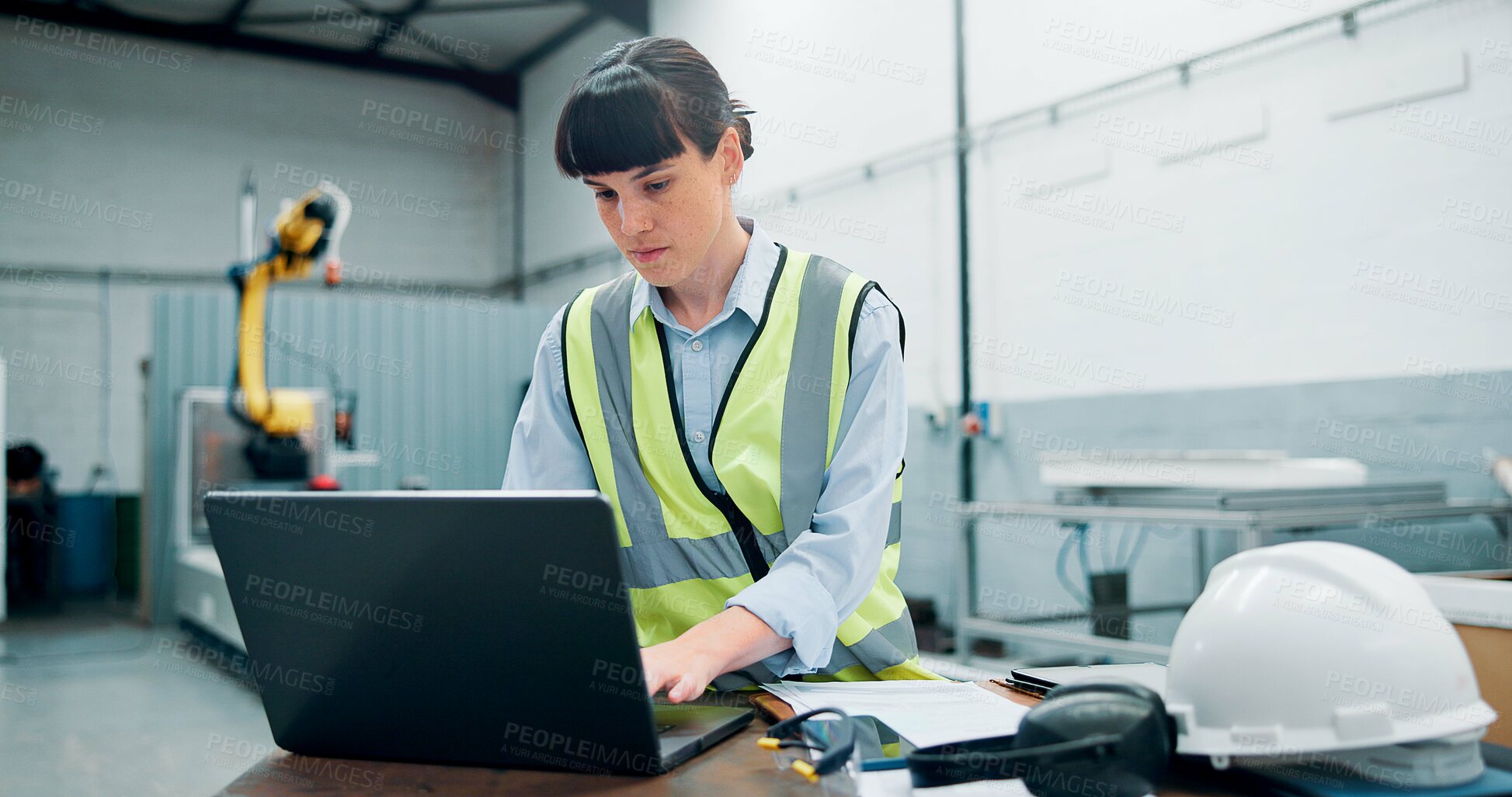 Buy stock photo Engineer, laptop and woman with robotics for production at assembly line in factory. Computer, automation or worker research for manufacturing process, industry 4.0 or typing software for programming