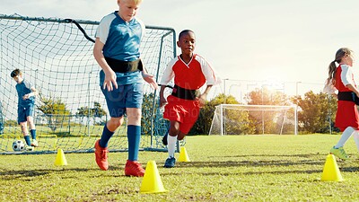 Buy stock photo Kids, running and drills for soccer practice for strength training, fitness exercise and sports workout. Children, equipment and resistance for endurance, speed challenge and team for cardio routine