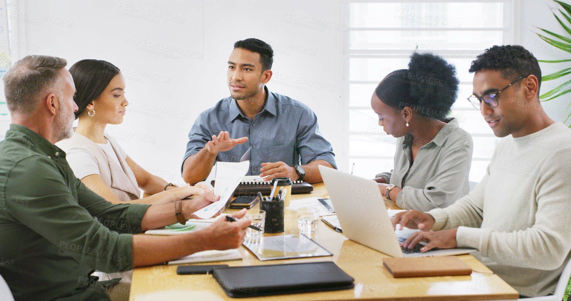Buy stock photo Documents, laptop and meeting with business people in office boardroom for review. Computer, paperwork and project management with employee team in professional workplace for feedback or update