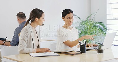 Buy stock photo Laptop, business women and planning in meeting to review brand proposal with graphic designer. Computer, point and discussion with creative team in office for logo design, explain project or briefing