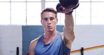 Kettlebell, breathing and man in gym, fitness and challenge with workout, wellness and endurance. Equipment, athlete and person in health center, routine and training with exercise, power and strong