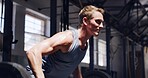 Fitness, gym and man with barbell for row, strength training or workout challenge for wellness. Strong bodybuilder, weight lifting and exercise in health club for power, energy and muscle development