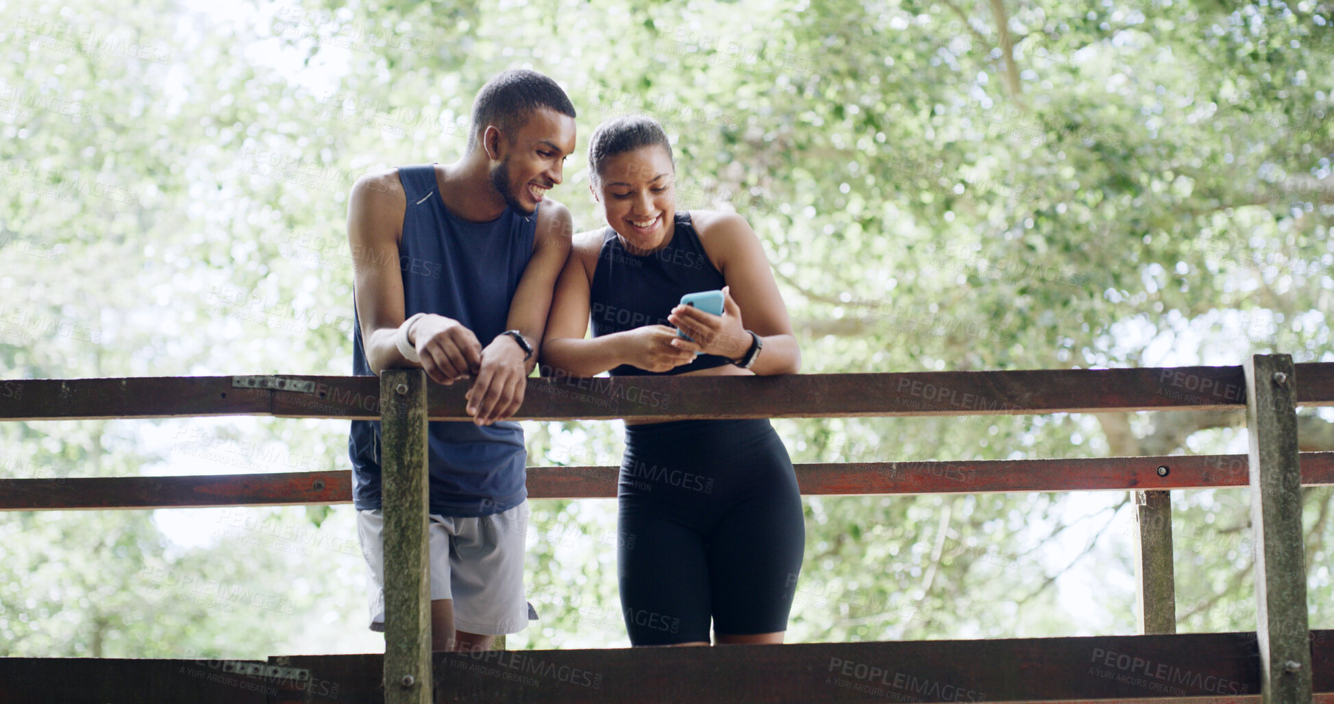 Buy stock photo Hiking, nature or couple with phone on bridge, outdoor exercise or digital map for trail navigation. Fitness, step counter or people with mobile location app, fauna or flora research break from below