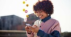 Happy woman, phone and reaction with emoji in city, laugh and texting with funny chat, meme or icon. African person, smartphone and smile with sign, symbol or mobile app on social media in urban town