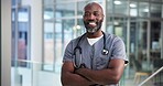 Portrait, black man and doctor with arms crossed in hospital for career pride, about us and healthcare services. Happy, mature person and ambition for medical support, cardiology surgeon and wellness