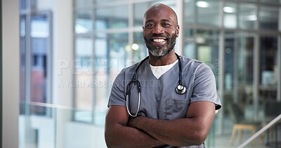Buy stock photo Portrait, black man and doctor with arms crossed in hospital for career pride, about us and healthcare services. Happy, mature person and ambition for medical support, cardiology surgeon and wellness