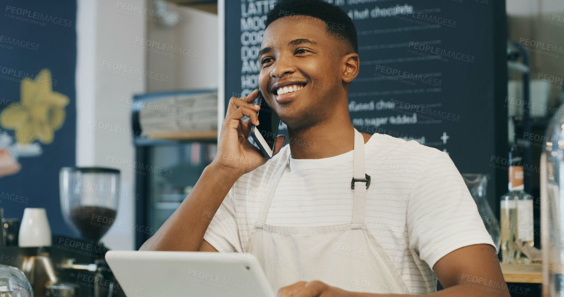 Buy stock photo Man, barista and phone call at coffee shop, smile and contact for stock, deal or inventory management. African person, waiter and happy for talk, smartphone or chat with supplier for discount at cafe