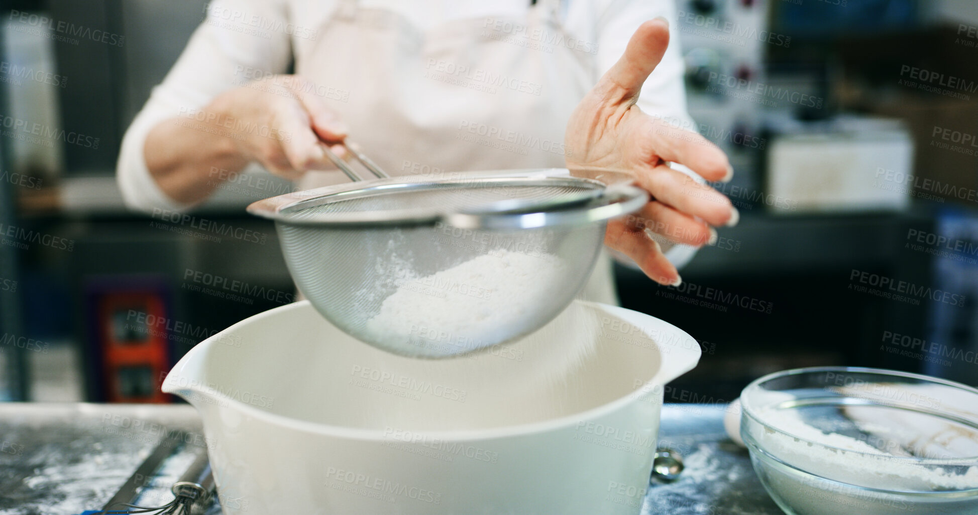 Buy stock photo Hands, baking and flour sieve in kitchen for meal prep, culinary process or pastry chef. Mesh equipment, bakery or woman cooking food for catering, recipe or powder with ingredients in small business